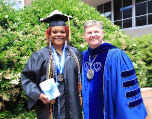 Barton College President Doug Searcy congratulating Graduate Sherica Cox